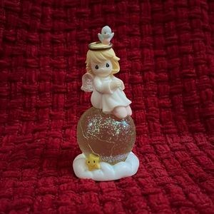 Precious Moments “Angel sitting on the earth” Collectible Figurine
